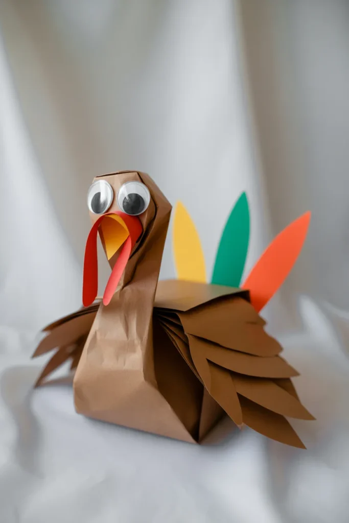 30 Fun and Creative Thanksgiving Crafts for Kids 16 paper bag turkey with googly eyes