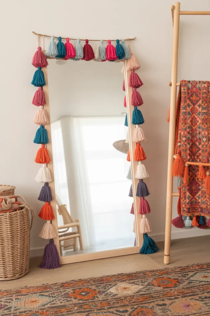 11 Bohemian Mirror Wall Decor Ideas to Elevate Your Space 10 mirror surrounded by colorful tassels hanging from the edges