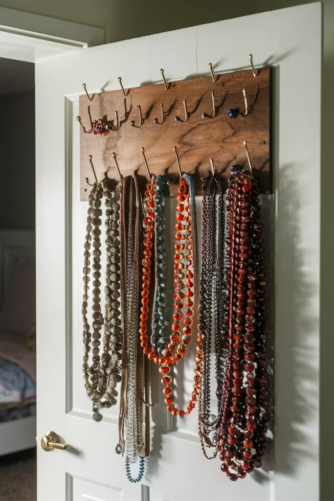 17+ Clever DIY Jewelry Storage Ideas to Keep Your Collection Tangle-Free 17 photo of a stained plywood board with multiple hooks