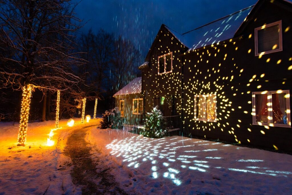 17 Magical Christmas Outdoor Decor Ideas to Transform Your Home This Holiday Season 12 Projector Snowfall Lights